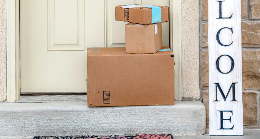 Deliveries on the front porch of a house with a welcome sign in Dothan